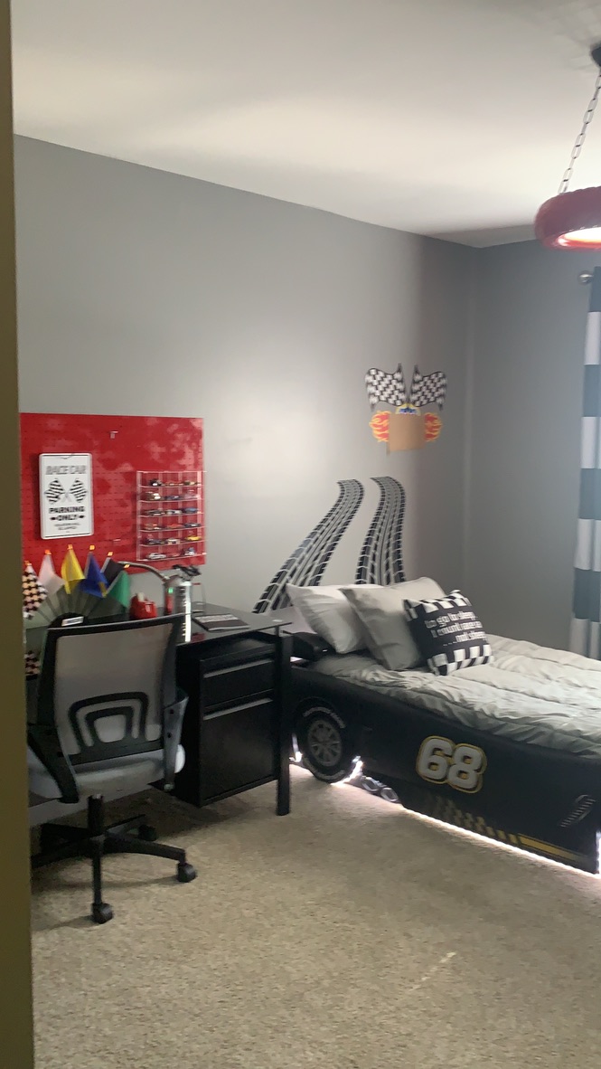 Completed RRGA bedroom featuring a race car bed and personalized details.